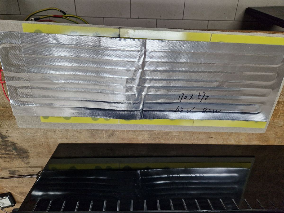 Heating film on an insulating board for a battery with HEAT heating